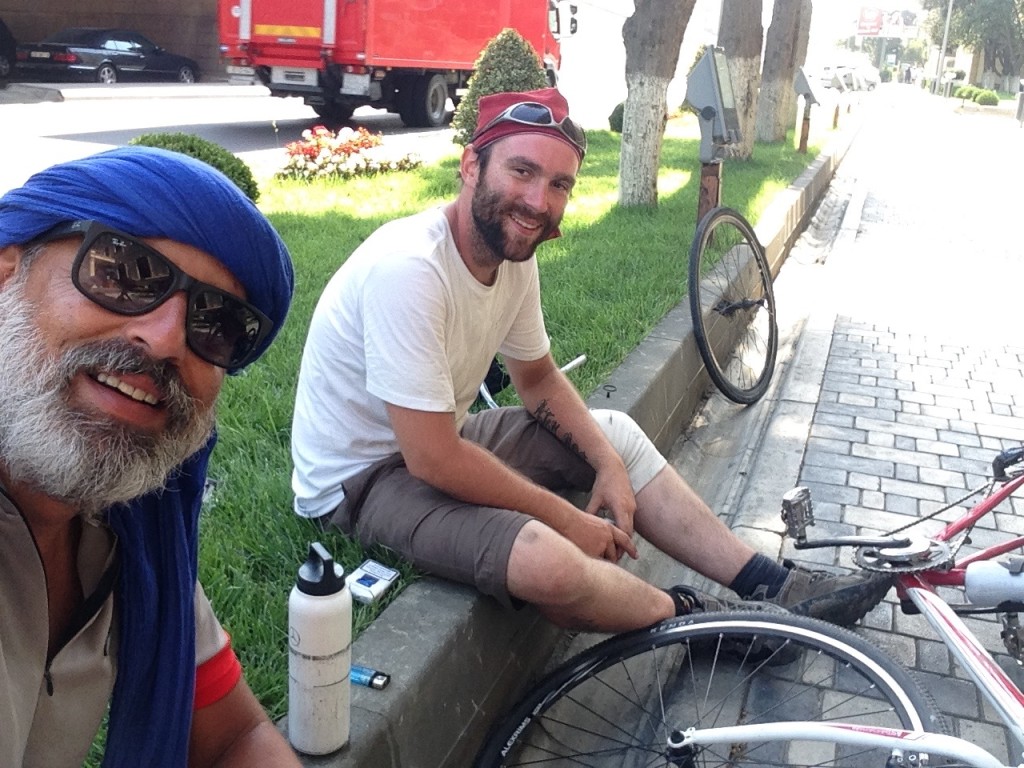 Gwyd repairing their flat tire.