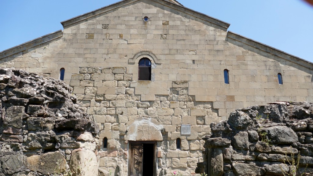 Tsromi Church dates from  the early Middle Ages and was built in 626 - 634 by the Eristavi of Kartli Stefanoz II. A Christian church was in Tsromi even in the fourth century and on the ruins of the old church, Stefanoz II built the current domed church. At the turn of the XI and XII, and XVI and XVII centuries, the temple was damaged several times. On September 24, 1731, during the invasion of the Avars, the wall of the church was destroyed. On May 8, 1940, an earthquake damaged the most significant part of the monument, the dome, its wall, western and southern arches collapsed, and the western wall  leaned. In 1949, restoration began. In 1959, the western wall was straightened, and in 1975 a temporary wooden dome was placed on the  church. The church has three entrances - west, north and south, and is covered with tiles and stone. On the southwest side is a two-story space; the ground floor was reserved for women, and the top floor was intended for the nobility. The Altar of the church was lined with mosaics, most of which have been destroyed. The remains of the mosaic fragments were transferred to the Georgia Museum of Art. By order of the President in 2006, the church was given the status of a "Monument of National Importance."