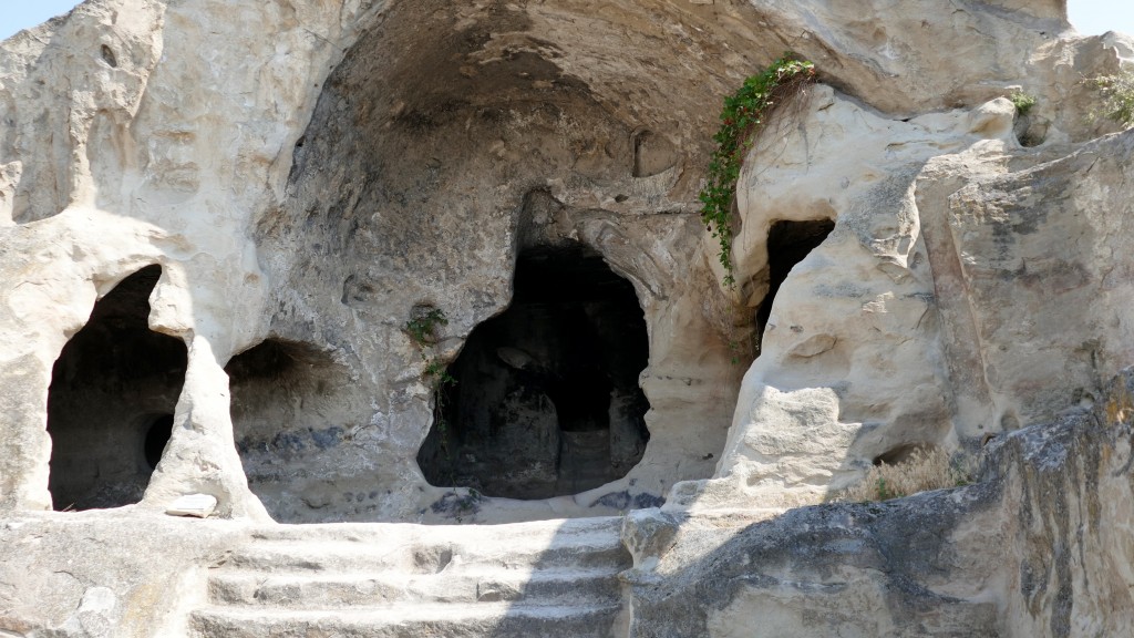 Uplistsikhe Uplistikhe is a rock-hewn city, located just 10 km east of Gori, on the left bank of the river Mtkvari. One of the oldest settlements in the Caucasus region, Uplistikhe is first mentioned within the pages of history in the VII century. Uplistiskhe and its surrounding archeological and architectural monuments belong to a distinct group, the oldest of which dates back to the early Bronze Age, and are considered to be relics of the Kura-Araxes culture.