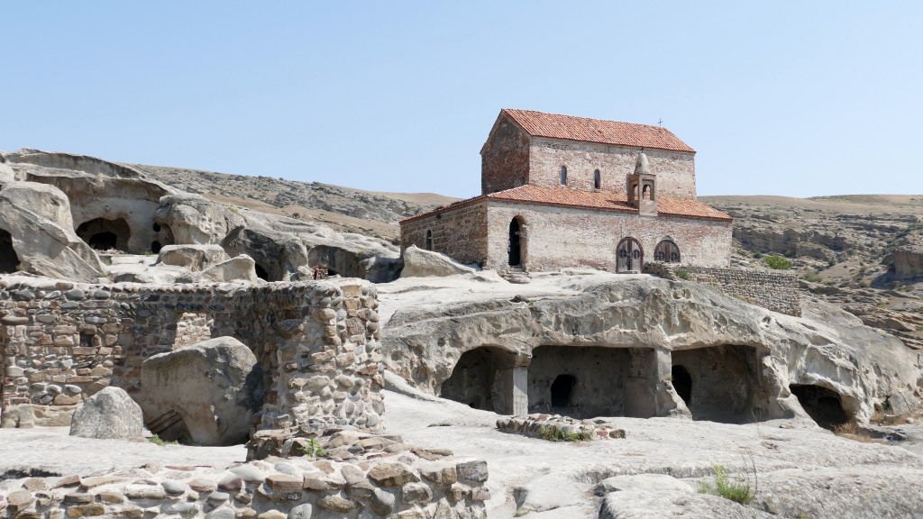 Uplistsikhe Uplistikhe is a rock-hewn city, located just 10 km east of Gori, on the left bank of the river Mtkvari. One of the oldest settlements in the Caucasus region, Uplistikhe is first mentioned within the pages of history in the VII century. Uplistiskhe and its surrounding archeological and architectural monuments belong to a distinct group, the oldest of which dates back to the early Bronze Age, and are considered to be relics of the Kura-Araxes culture.