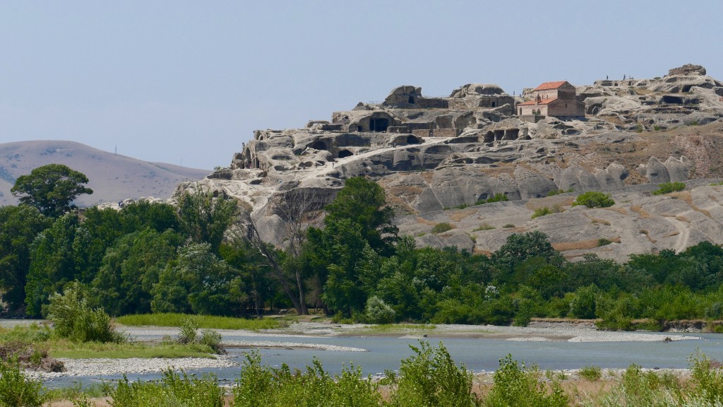 Uplistsikhe Uplistikhe is a rock-hewn city, on the left bank of the river Mtkvari. One of the oldest settlements in the Caucasus region, Uplistikhe is first mentioned within the pages of history in the VII century. Uplistiskhe and its surrounding archeological and architectural monuments belong to a distinct group, the oldest of which dates back to the early Bronze Age, and are considered to be relics of the Kura-Araxes culture.