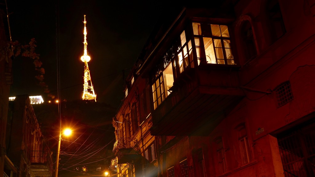 Tbilisi's streets at night and at the background Mtatsminda Park. Mtatsminda is a family amusement facility located atop Mount Mtatsminda overlooking the Georgian capital Tbilisi.