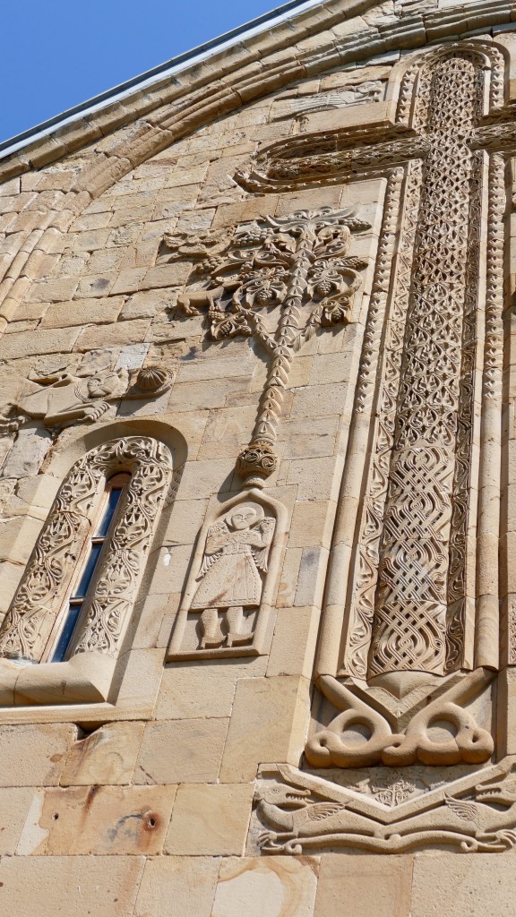 The larger Church of the Assumption (Ghvtismshobeli) was built in 1689 for the son of Duke Bardzem. It has a central dome and richly decorated facades, including a carved north entrance and a carved grapevine cross on the south façade.